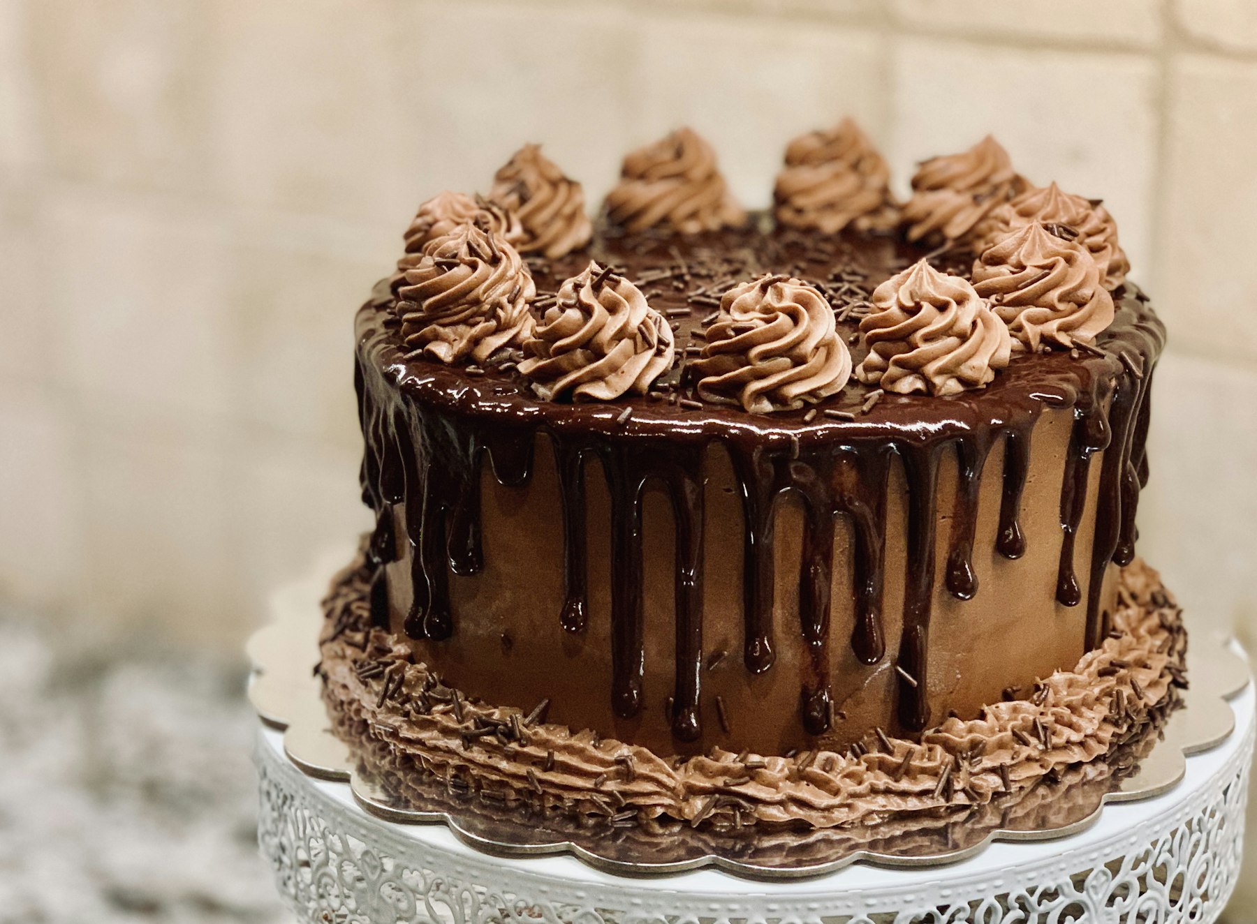 Slice of dark chocolate cake with a glossy crumb