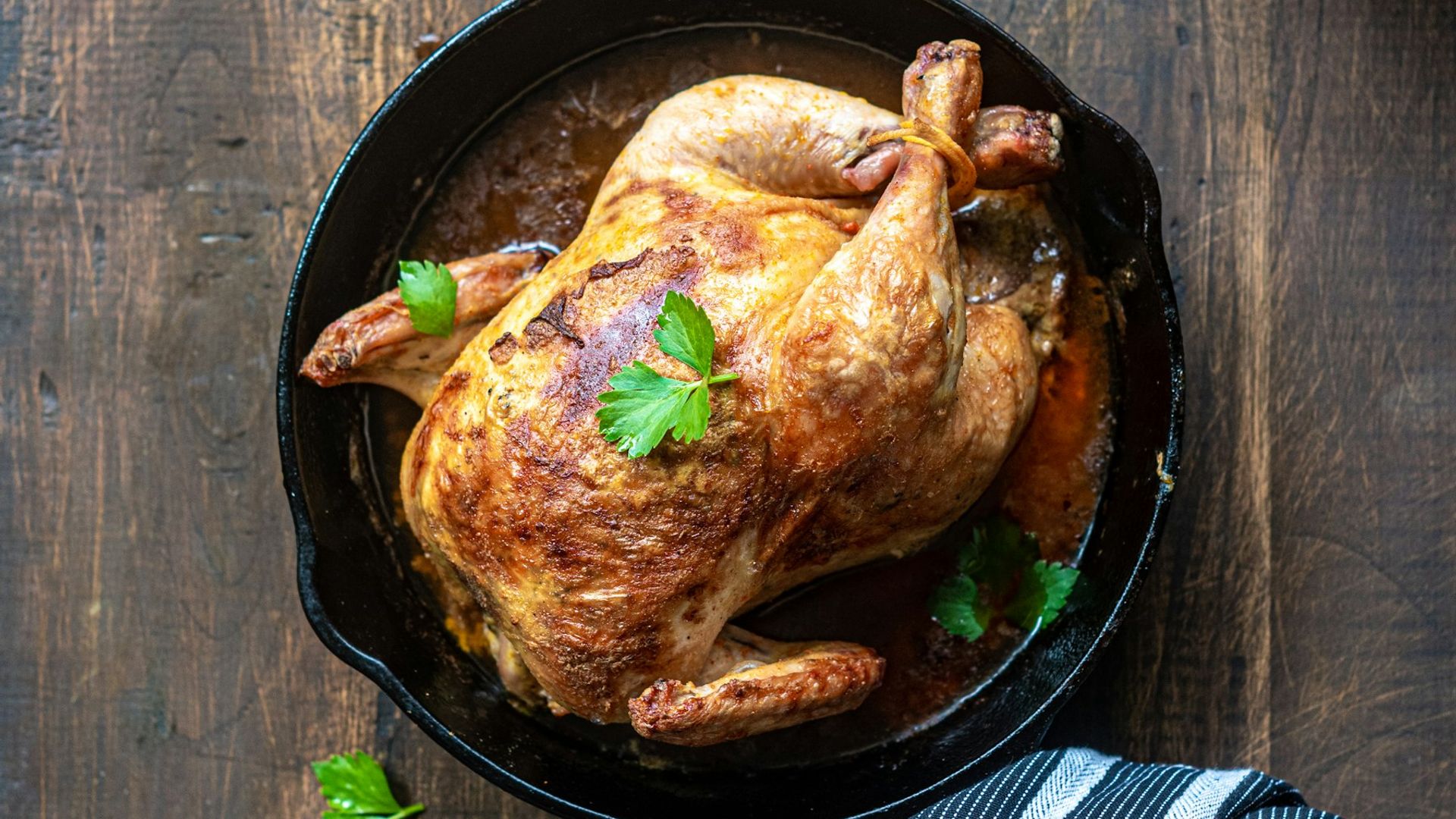 Roast chicken with bronzed skin on a platter